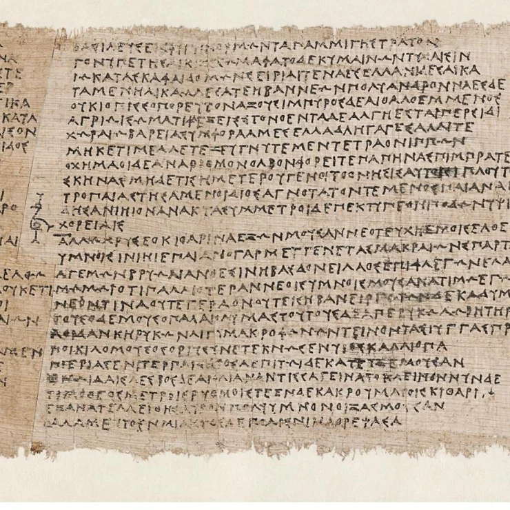 Close-up of a papyrus column of Greek capitals, with a bird-shaped mark in the left margin